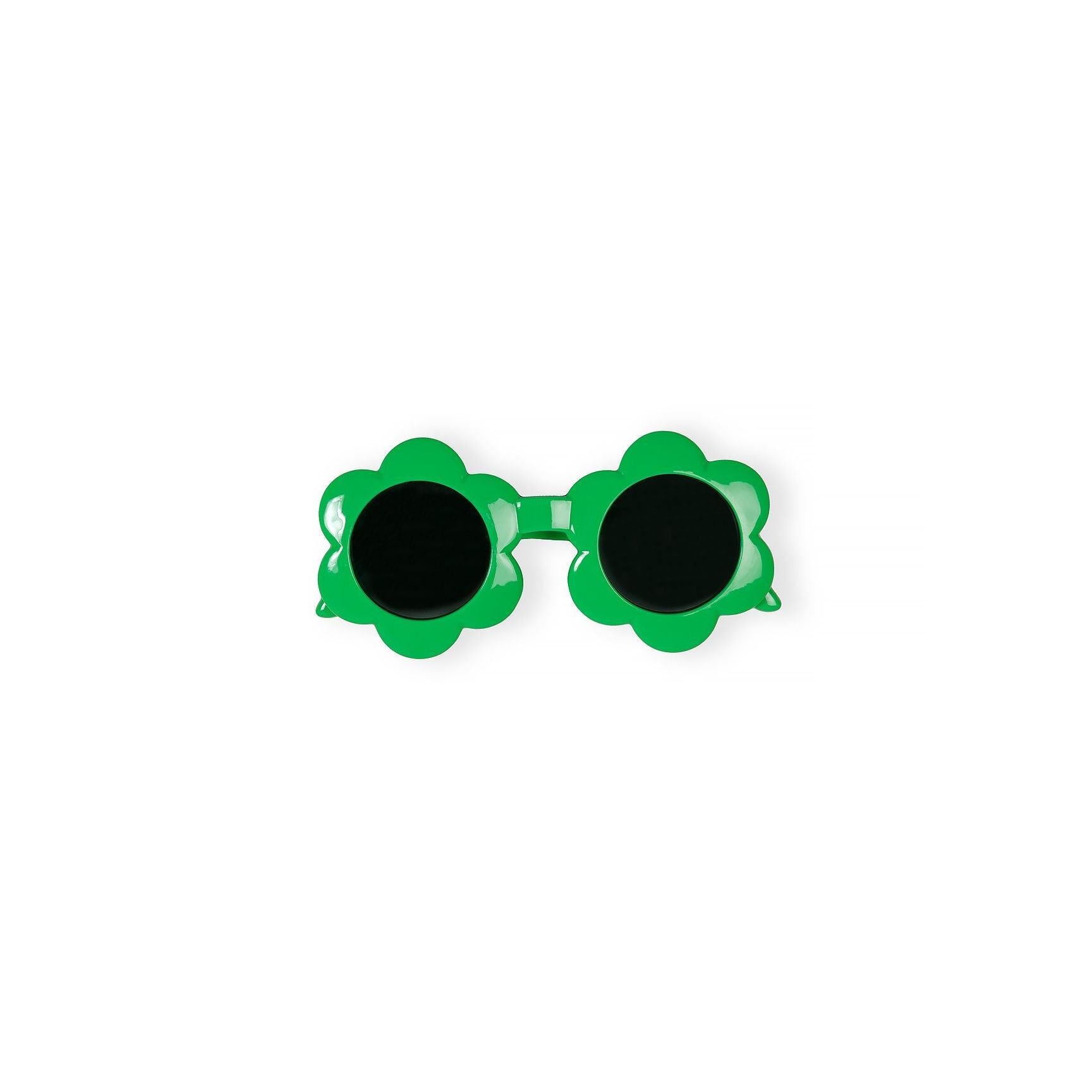 Close-up detail of green flower-shaped sunglasses with dark lenses and curved temple arms