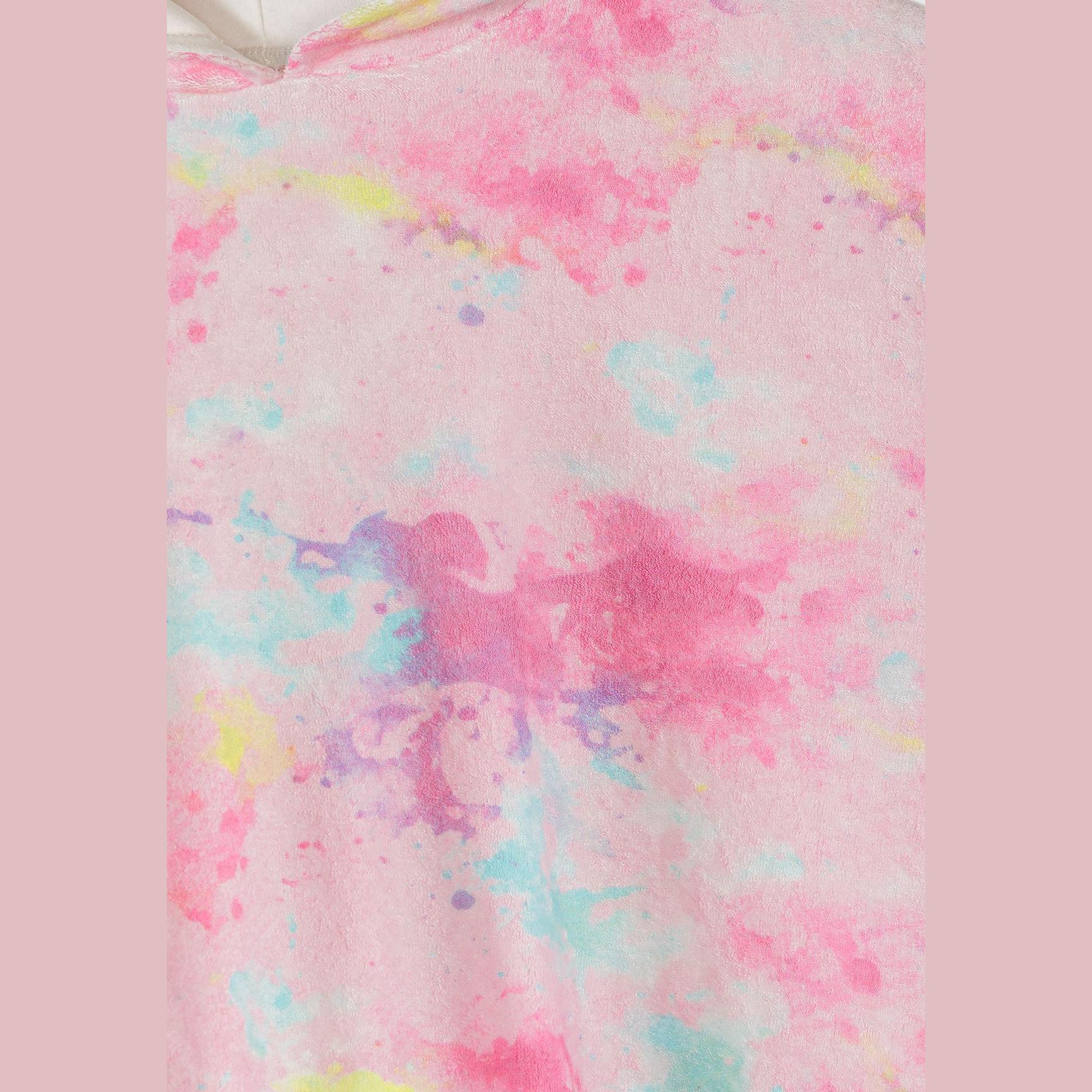 Close-up detail of the vibrant tie-dye fabric showing pink, blue, purple and yellow watercolour-effect pattern