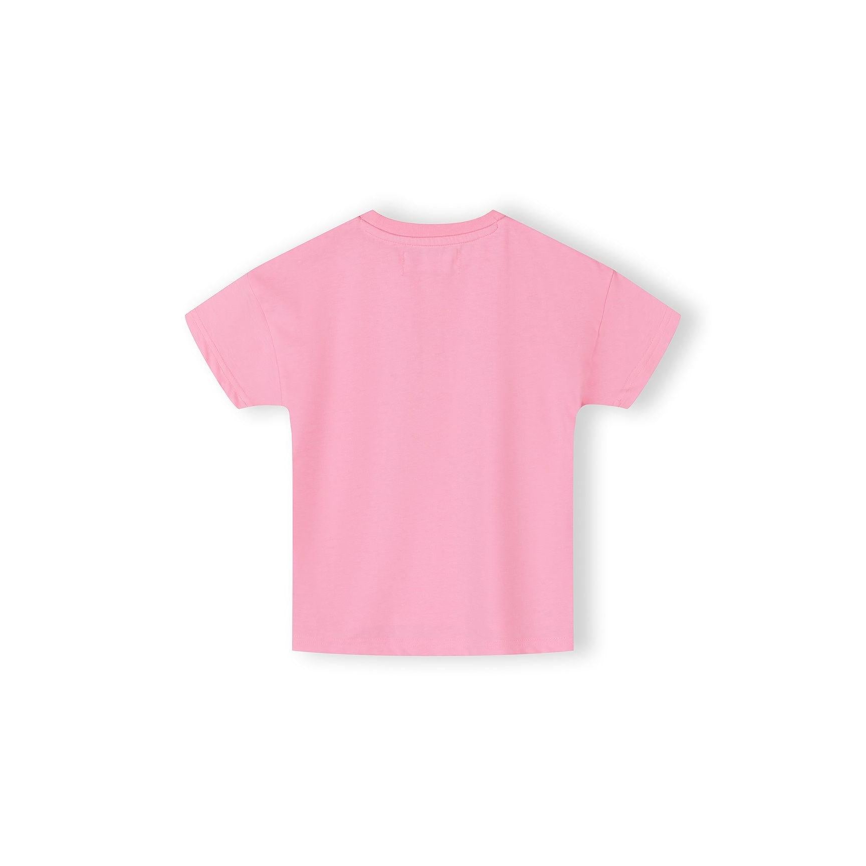 Close-up detail of pink cotton t-shirt fabric showing bow print pattern with blue bows, text elements including 'AWESOME', 'GIRLY', 'COOL' and heart shapes scattered across pink background