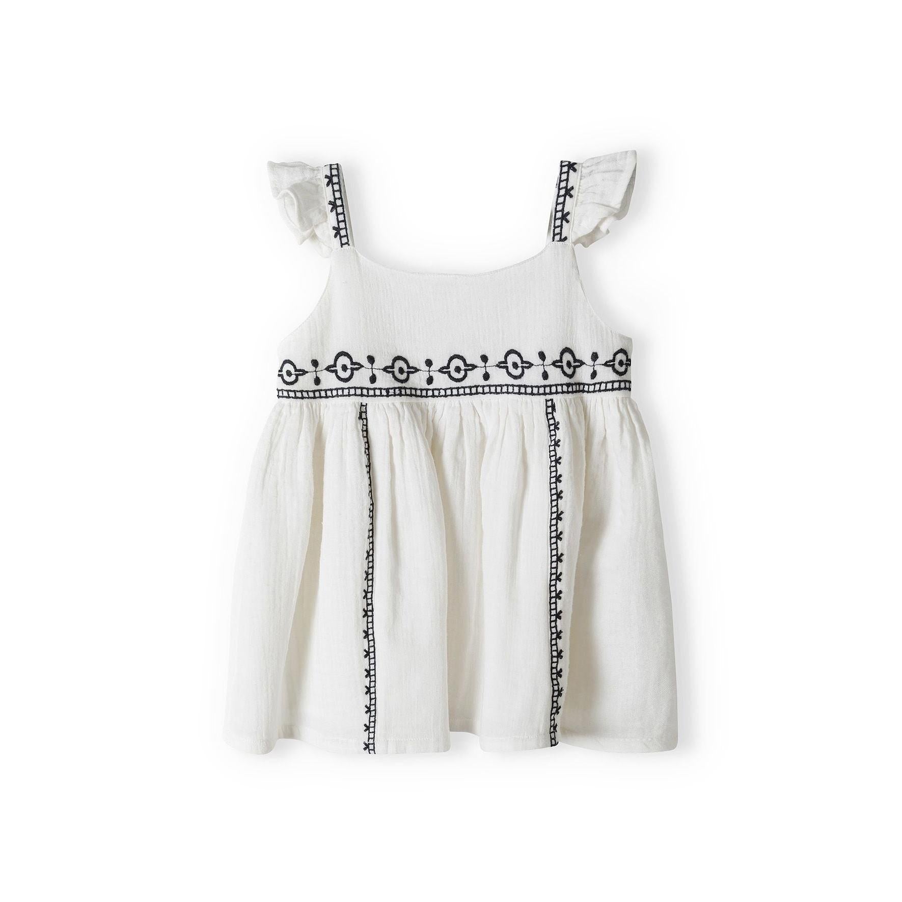 Black and white gingham check harem trousers with elasticated waistband and cuffs photographed flat on white background