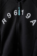 Boys zip thru sweatshirt sporty black 3-14y featuring bold white letters and a teal zip pull. Soft polyester construction.