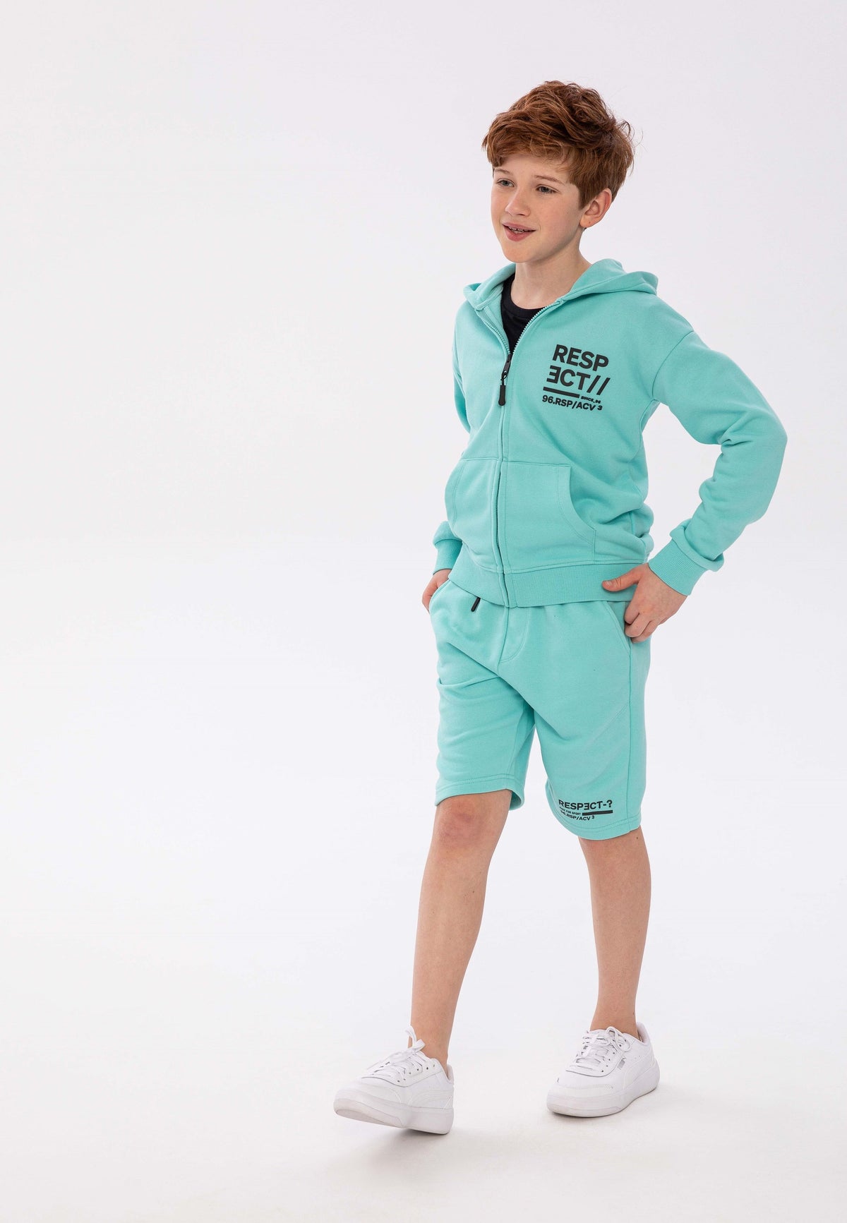 Mint jogger shorts, worn front.