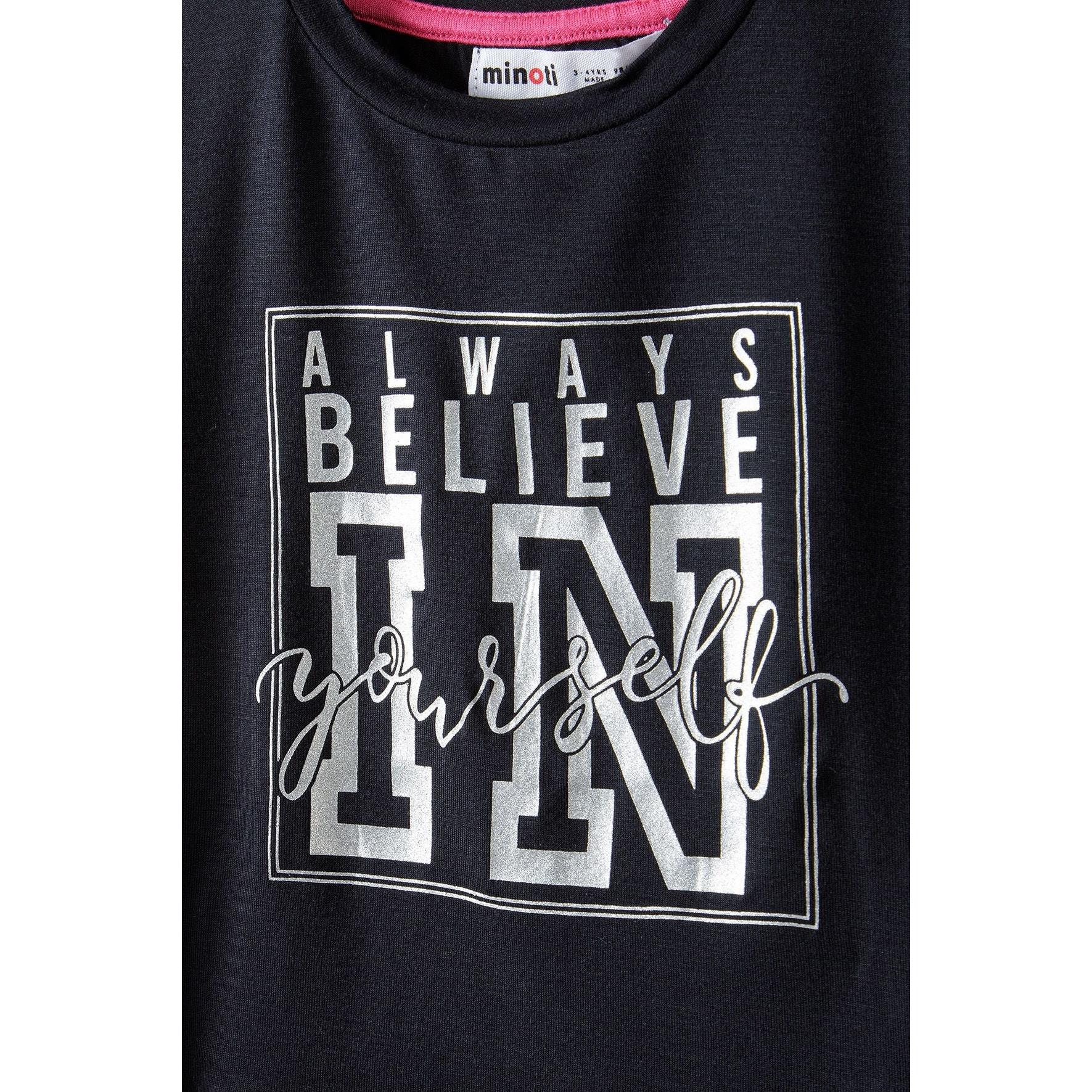 Close-up detail of black t-shirt showing white motivational print 'Always Believe In Yourself' with Minoti label visible at neckline