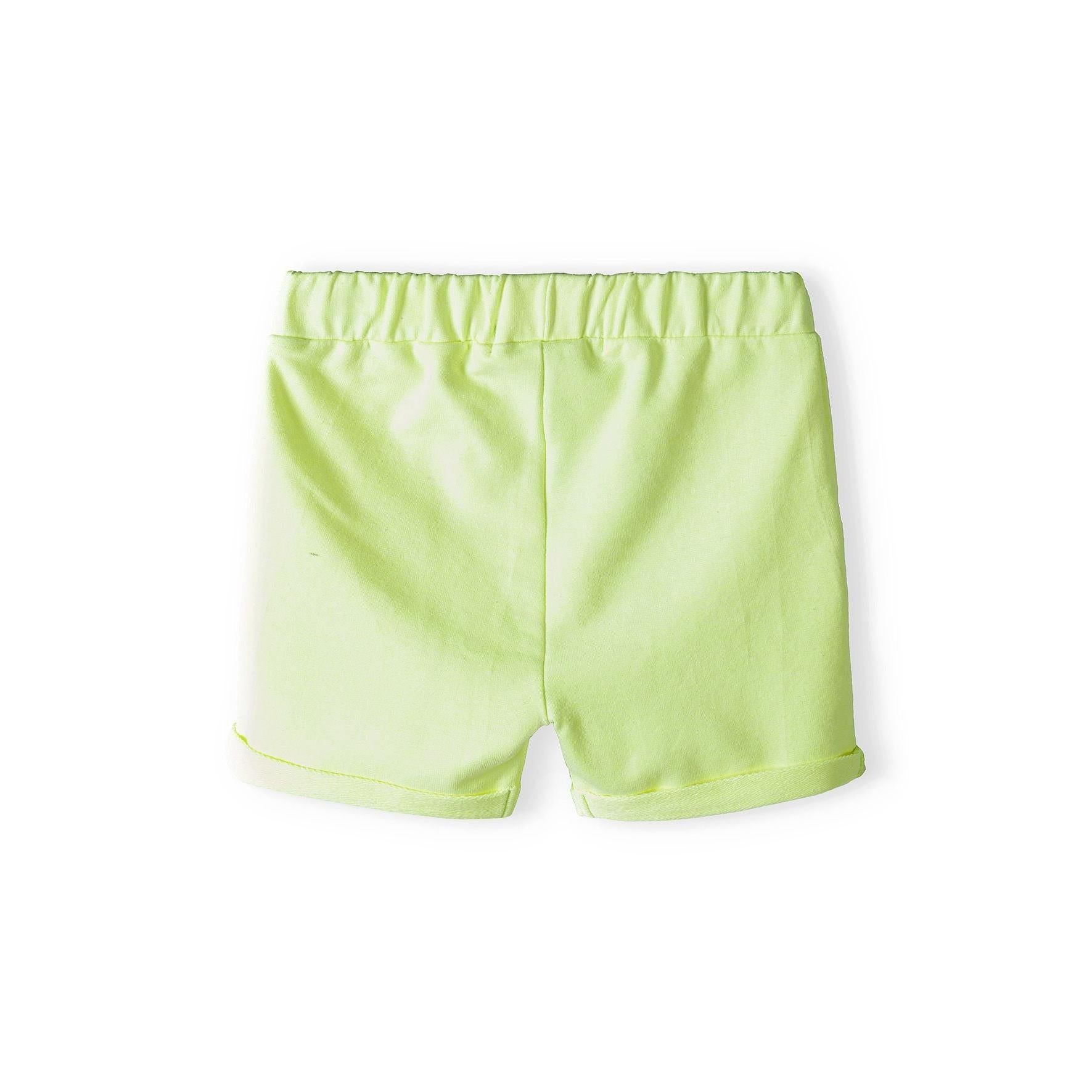 Lime green fleece shorts laid flat showing elasticated waistband and rolled hem cuffs on white background
