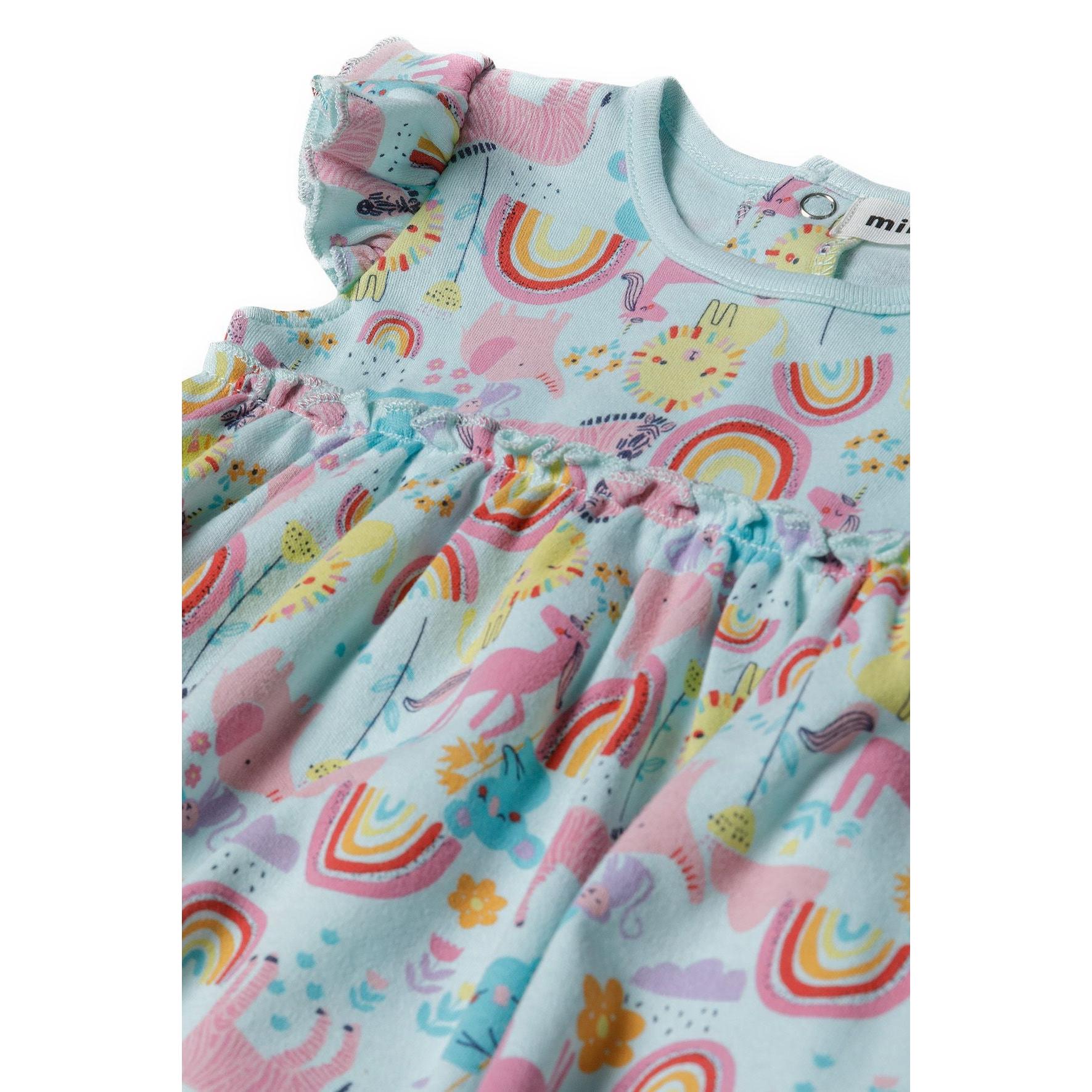 Close-up detail shot of turquoise bodysuit dress showing frill sleeve construction, neckline ribbing, and vibrant unicorn rainbow print pattern