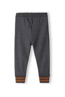 Soft fleece-lined jogpants in grey with orange stripes at the hems, perfect for boys aged 3m-3y. Designed for comfort.