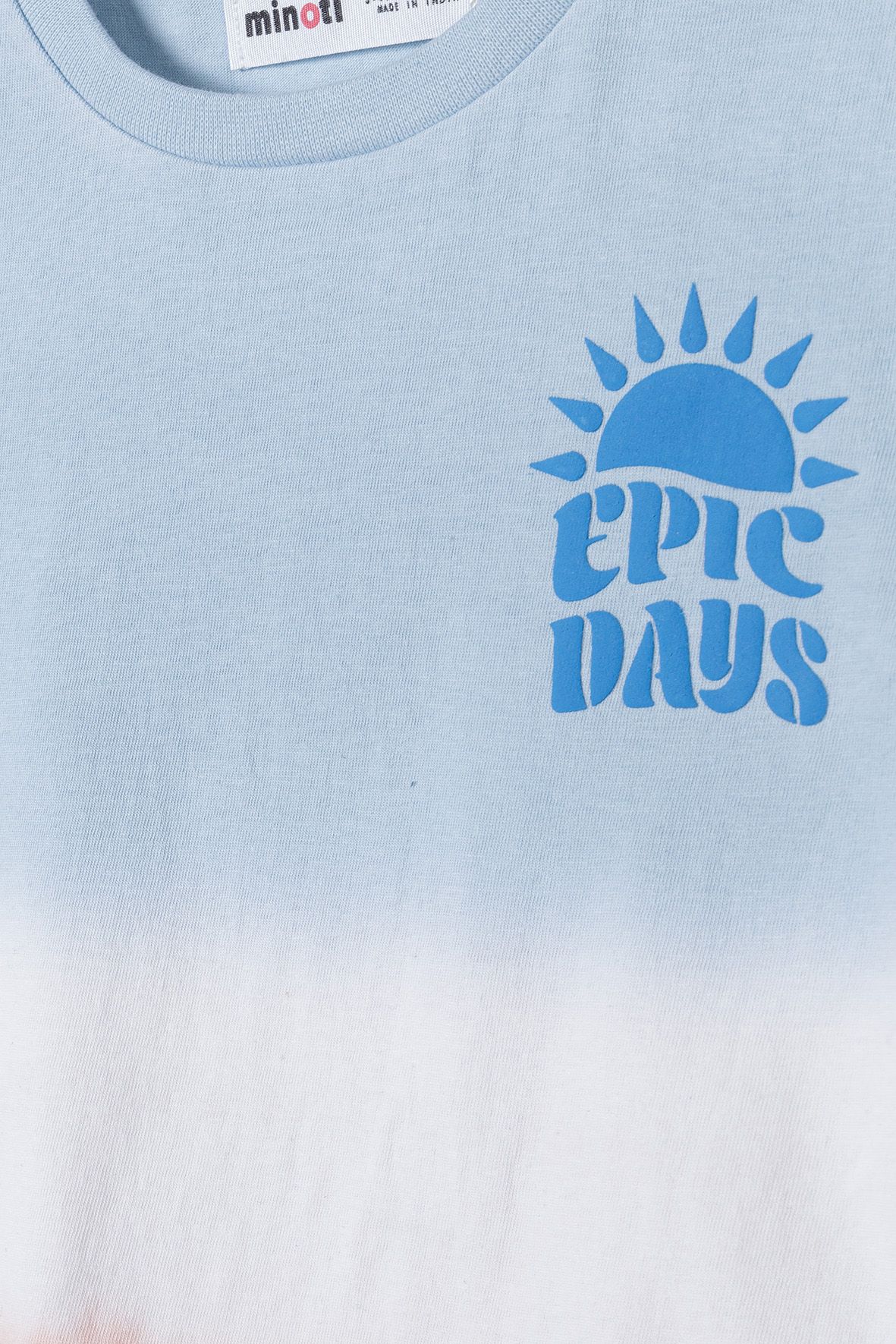 Pale blue, white and peach graphic t-shirt, chest graphic detail.
