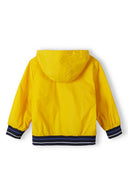 Boys windbreaker jacket with hood yellow 1-14y, lightweight design, bright yellow color, contrasting navy elastic cuffs, perfect for outdoor activities.
