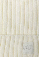Cream baby rib beanie with pom pom, soft knitted fabric, snug fit for 0-24m, features delicate lurex badge.