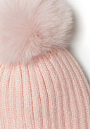 Knitted pink rib beanie with a playful pom pom, soft texture for baby comfort, suitable for 0-24m.