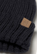 Black ribbed knit beanie set with tan leather patch and embroidered m