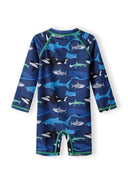 Boys all-in-one rash swimming costume navy 9m-4y with shark print, UV-filtered fabric, and long raglan sleeves.  