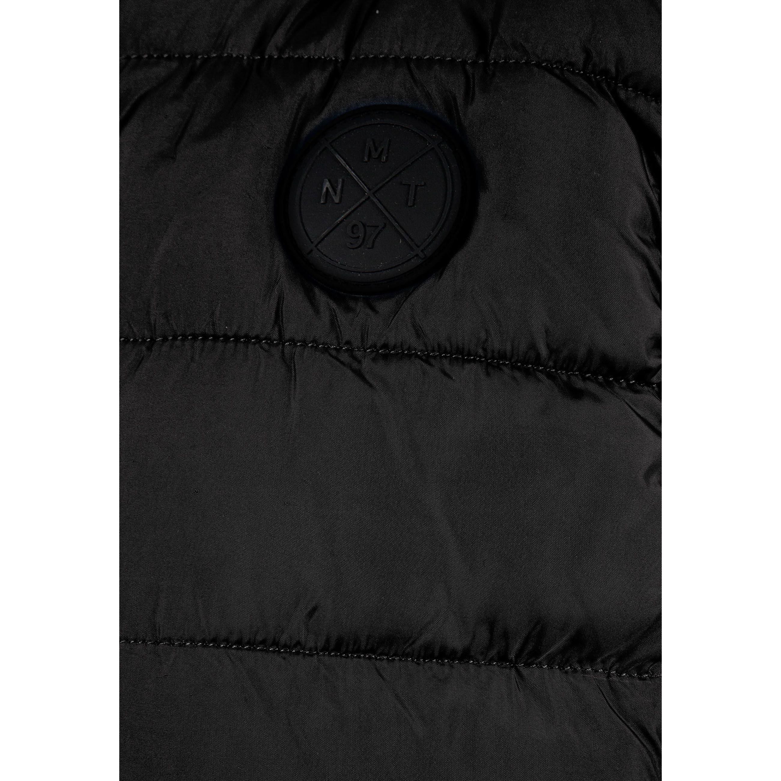 Detail view of black padded gilet front zipper and quilted chest panel construction