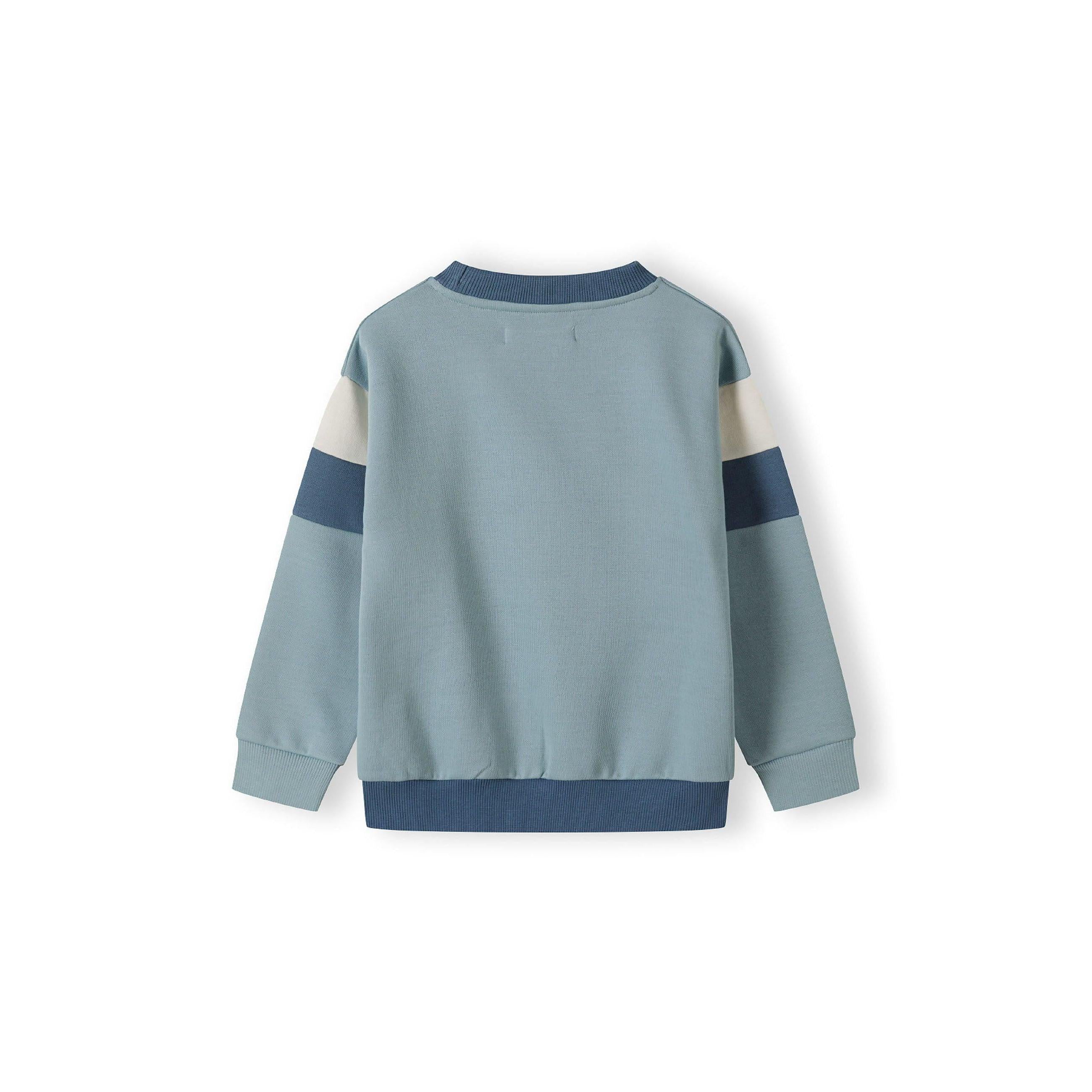 Close-up detail of blue joggers showing drawstring waistband and soft fabric texture