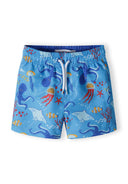 Bright blue boys board shorts with drawstring featuring ocean-themed print, lightweight mesh lining for ages 9m-8y.