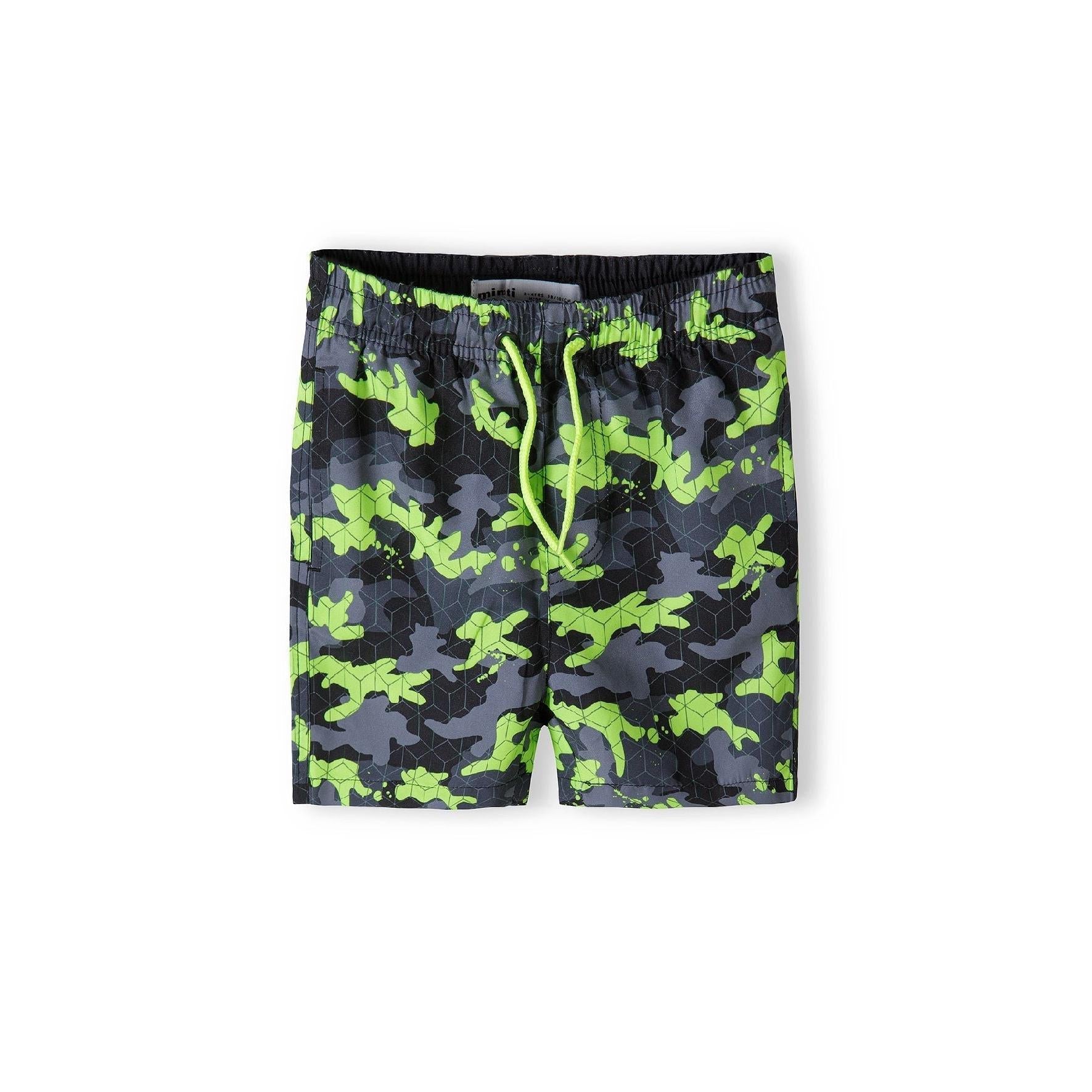 Green camouflage board shorts with geometric pattern overlay and bright lime green drawstrings, shown flat against white background