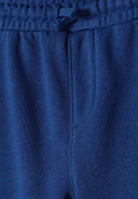 Cobalt blue joggers featuring a soft cotton blend, elastic waistband, and side pockets for boys, sizes 3-14y.