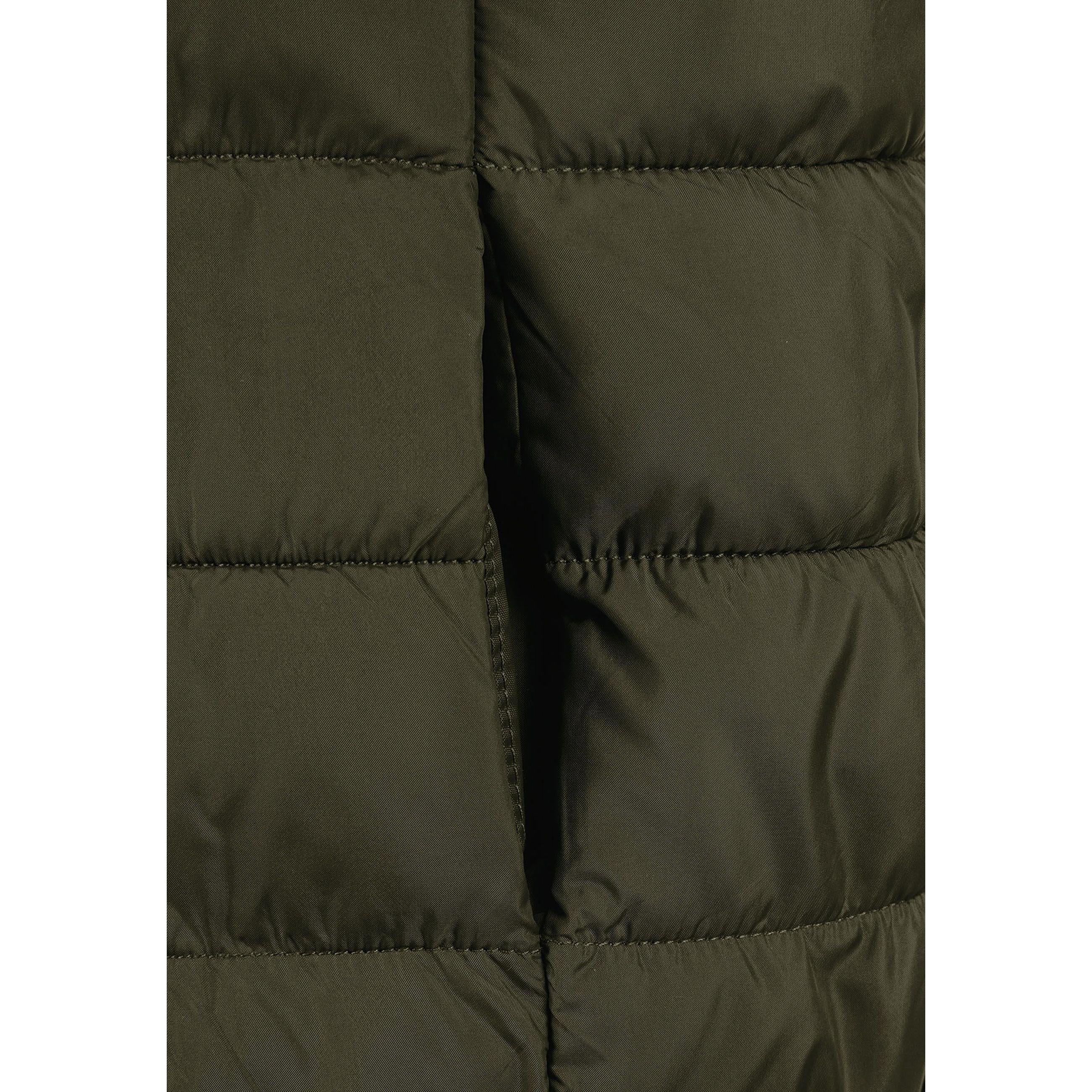 Close-up detail of khaki gilet showing quilted padding, zip closure and hood attachment