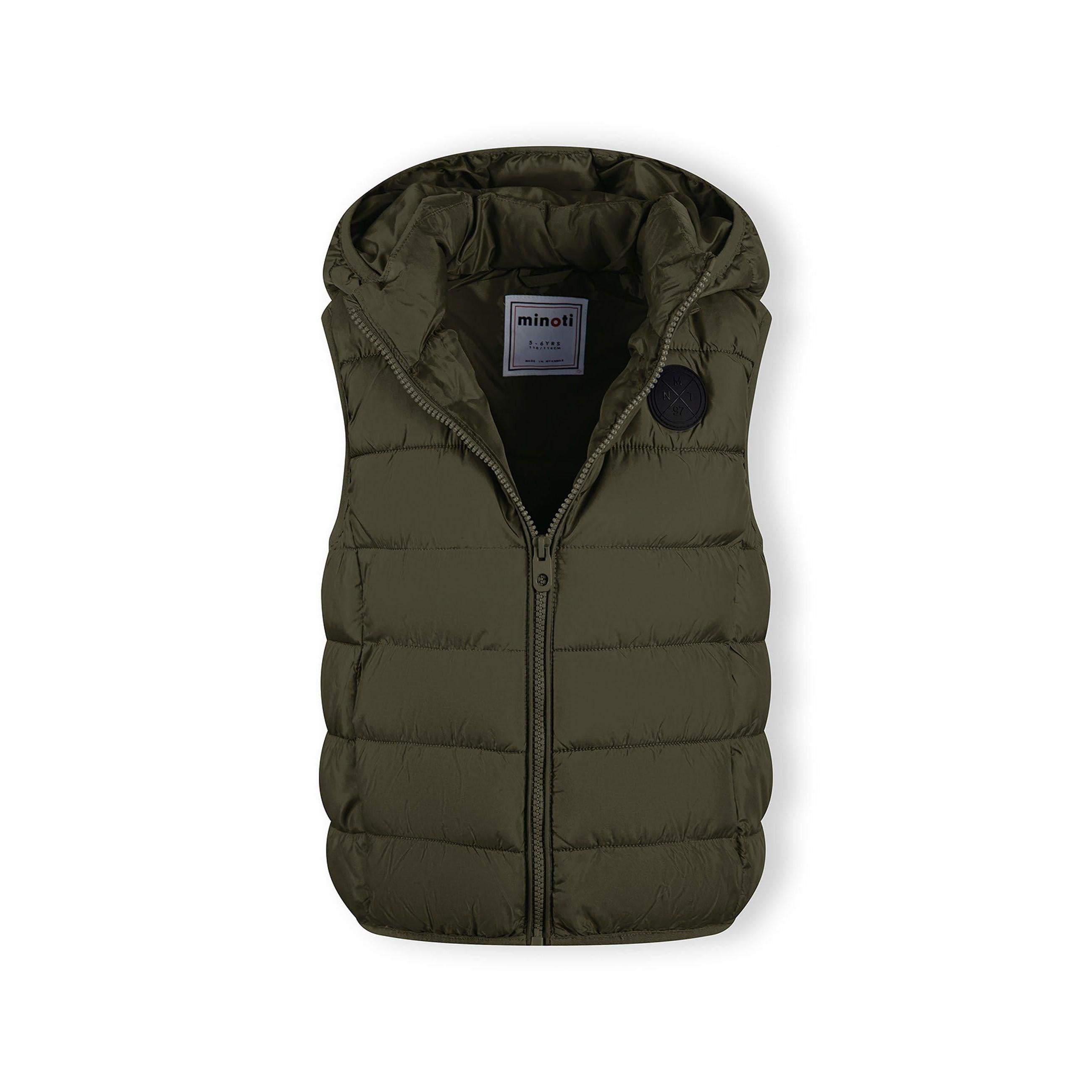 Close-up detail of khaki gilet showing quilted padding, zip closure and hood attachment
