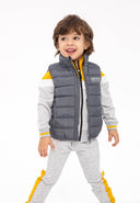 Boys padded gilet in dark gray with yellow accents and mns97 logo