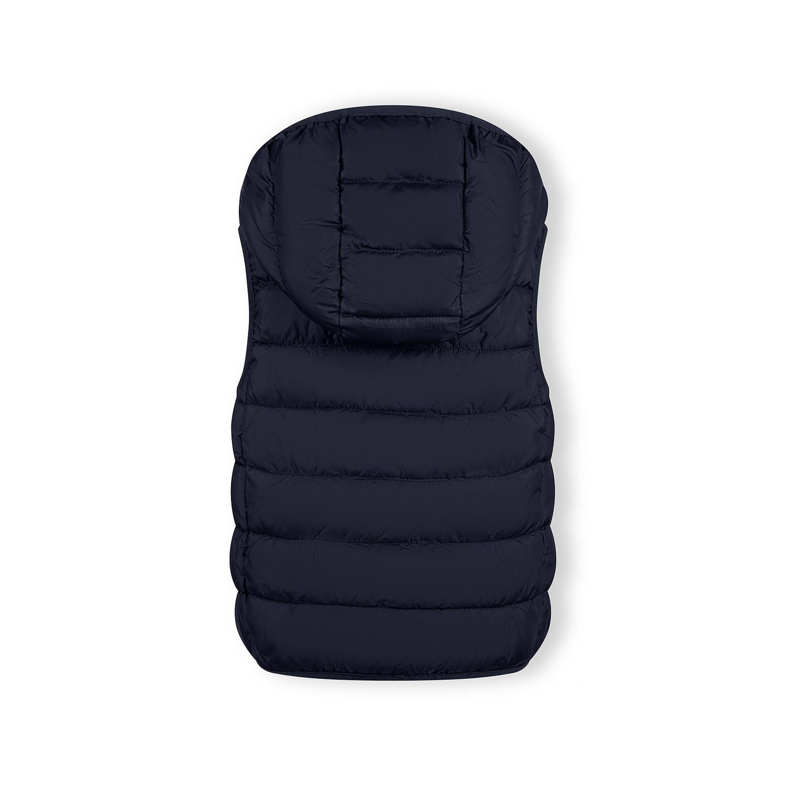 Close-up detail of navy padded gilet showing full zip closure, quilted panels and fabric texture on dark background