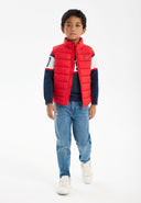 Red boys padded gilet with navy and white sleeve accents