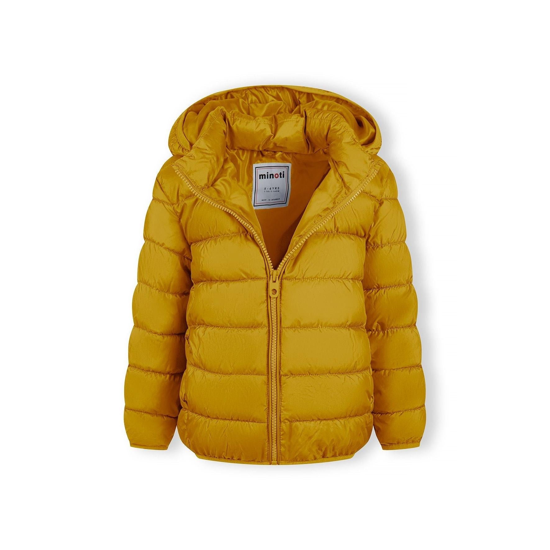 Detail shot of yellow padded jacket sleeve showing black circular logo patch on quilted fabric with horizontal stitching lines