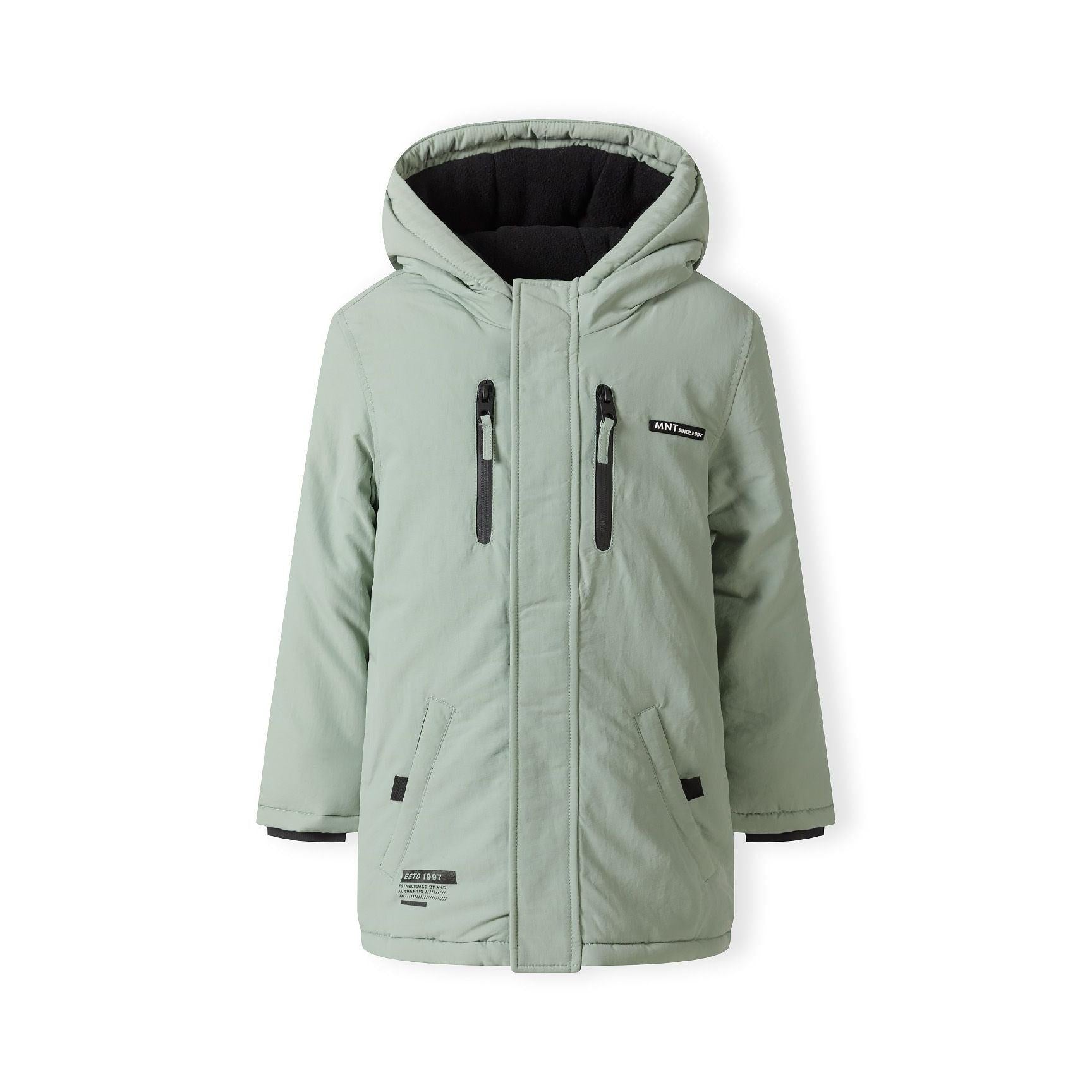 Sage green parka jacket laid flat showing front view with hood, multiple pockets, zippers and Minoti label, white background