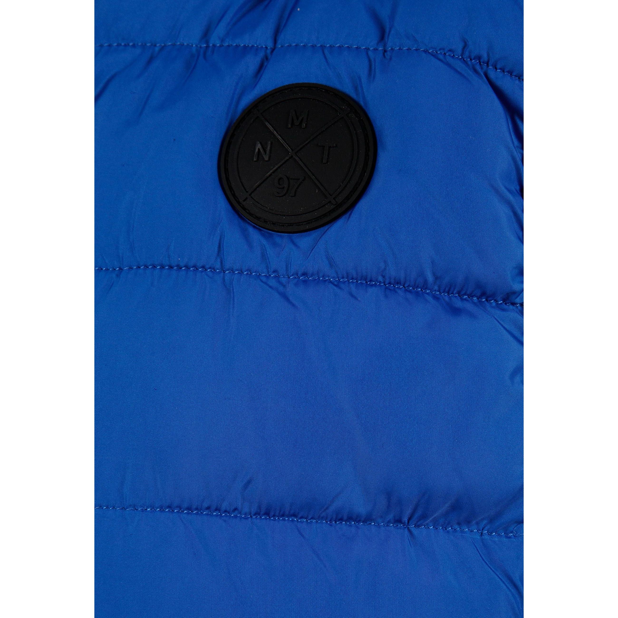 Close-up detail of cobalt blue padded gilet showing zip fastening, hood attachment and quilted texture