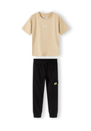 Boys short sleeve t-shirt with joggers set black 3-8y. Beige short sleeve t-shirt with embroidery paired with black fleece joggers.