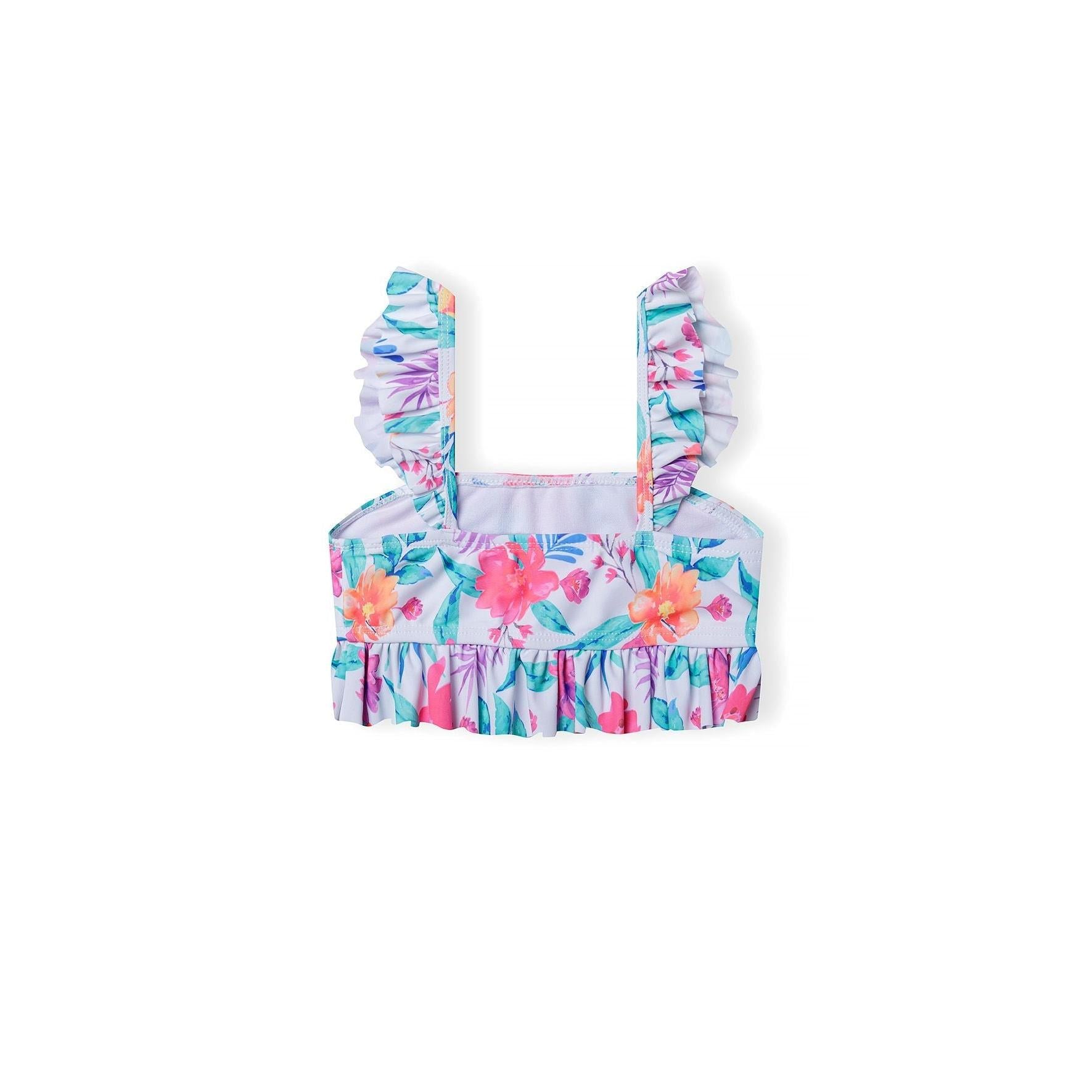 Close-up view of tropical floral bikini top with ruffled shoulder straps showing detailed hibiscus and palm leaf pattern on white background