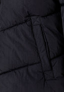 Girls black quilted hooded puffer coat with visible stitching and front pocket