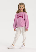 Girls fleece cargo joggers white 3-14y paired with a pink 'Hello Summer' sweatshirt. Soft cotton fleece for comfort.