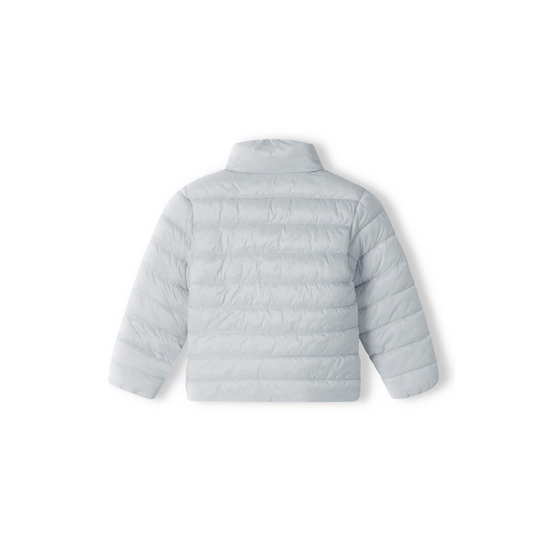 Close-up detail of silver-grey quilted jacket showing zip pocket with grey zipper pull and quilted texture