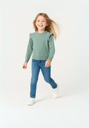 Girls jumper frill sleeves in soft sage green knit with child in jeans