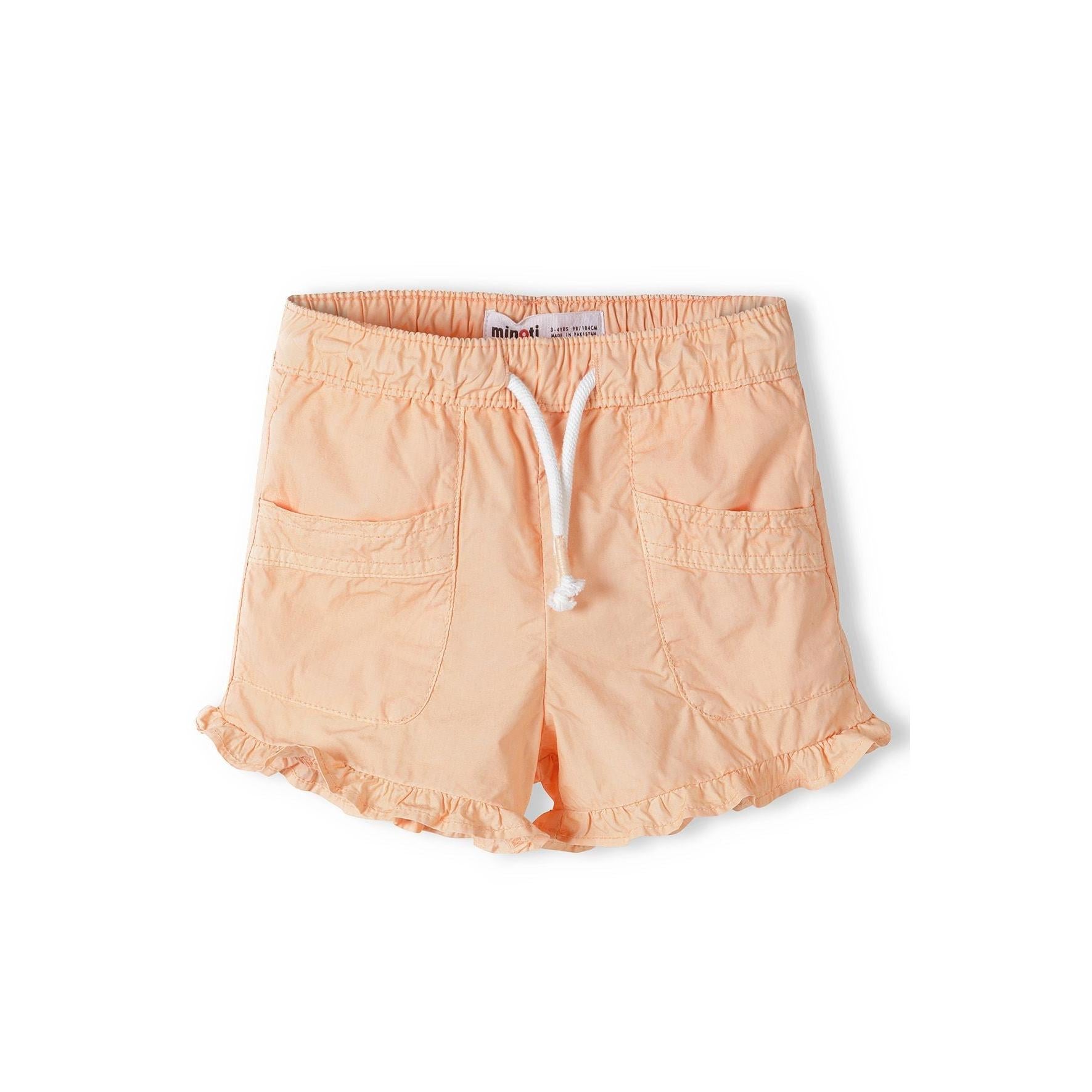 Back view of orange poplin shorts showing elasticated waistband and frill trim hem detail on white background
