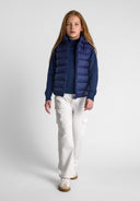 Girls quilted gilet in navy blue with zip detachable hood and puffer design