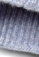 Knitted lilac yarn texture showcasing ribbed pattern. Soft, cozy material perfect for girls' multicolour yarn hat 2-14y.
