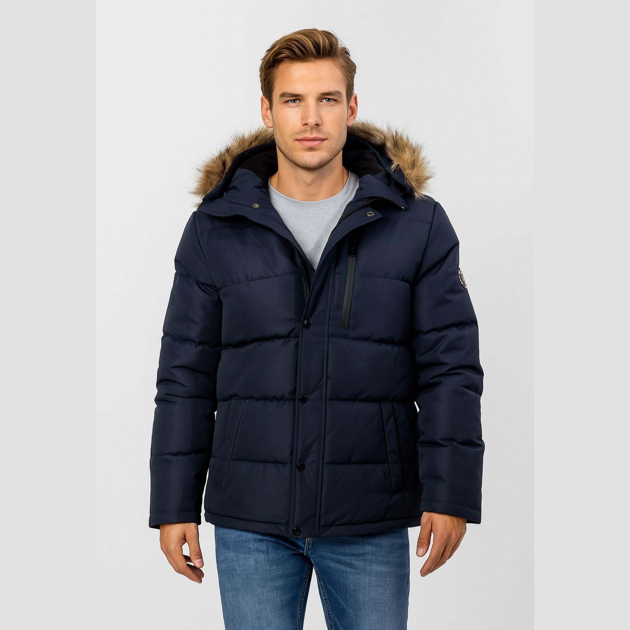 Men's navy quilted winter jacket with a faux fur-trimmed detachable hood, high collar, and multiple pockets.