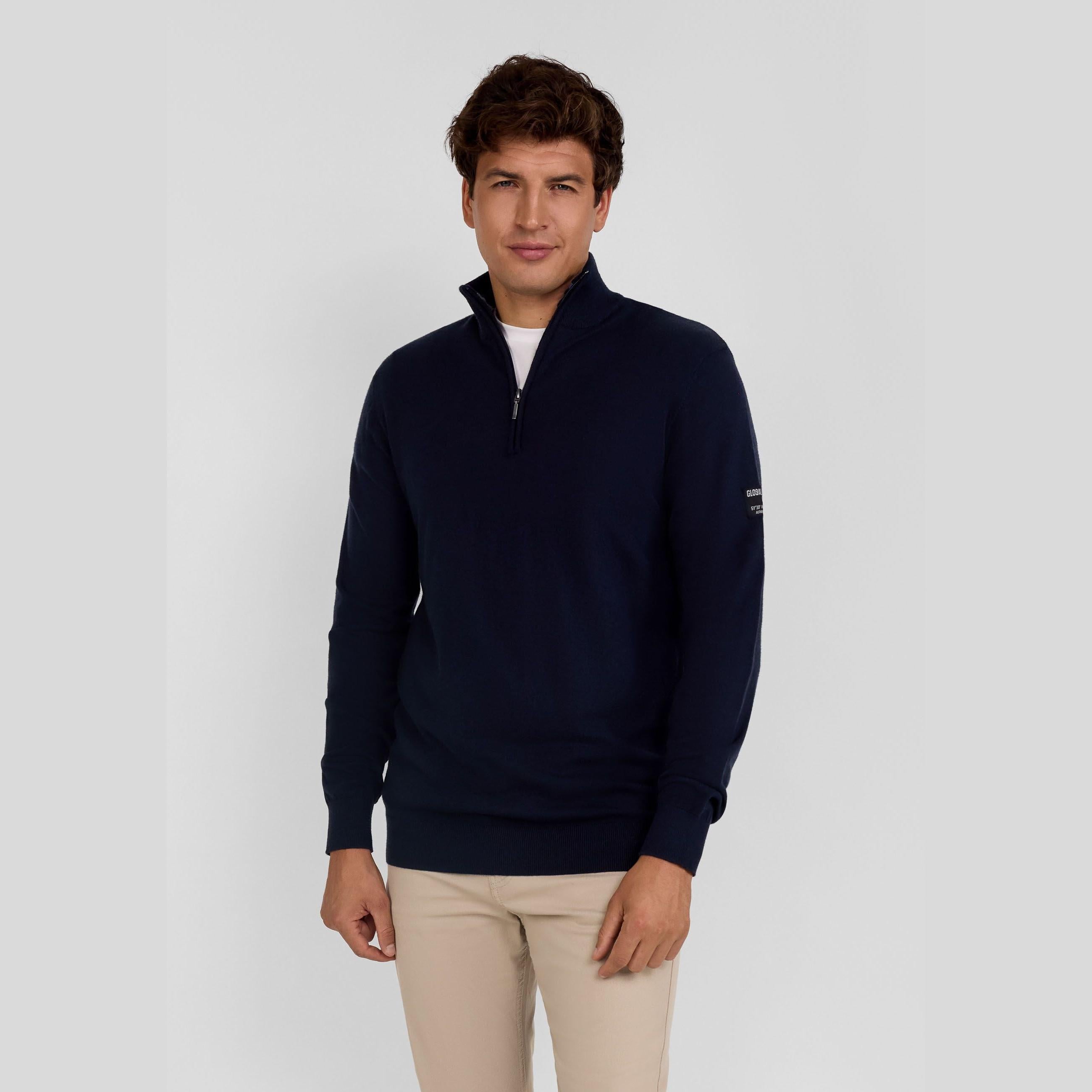 Men's navy half-zip jumper with adjustable collar, ribbed cuffs, and flexible hem.