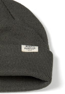 Dark gray ribbed knit unisex beanie hat with Minoti Surplus label